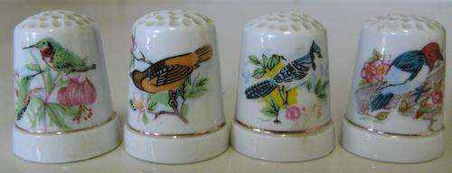 REDUCED PRICE TO R20-00 // SET OF 4 ORNATE SEWING FINGER. DIFFERENT BIRD