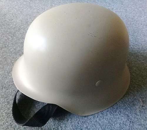 Classic German `steel` helmet - lightweight made from fibreglass with chinstrap. Size about 59cm.