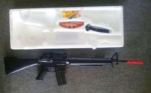 Airsoft M16 rifle with accessories. Spring action.