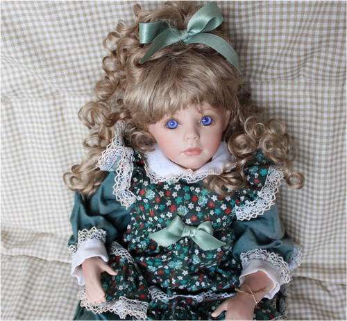Petite Porcelain Doll - Little girl sitting