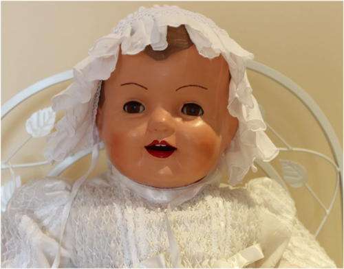 Large composition doll, beautiful smocked dress and bonnet.