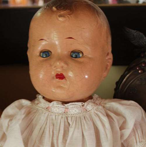 Full body antique doll.