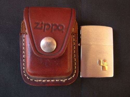Zippo Lighter, and leather pouch, almost as good as new. See pics , and description for details