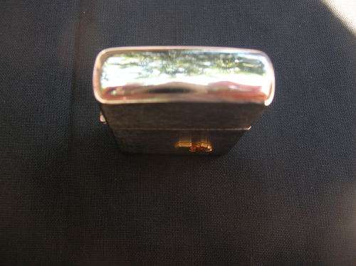 Zippo Lighter, and leather pouch, almost as good as new. See pics , and description for details