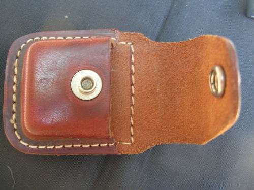 Zippo Lighter, and leather pouch, almost as good as new. See pics , and description for details