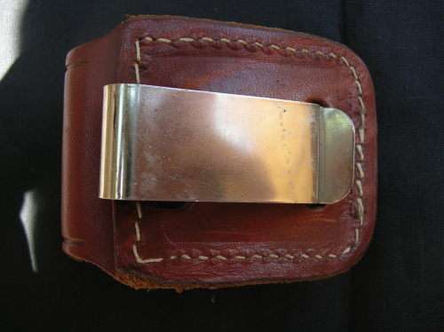 Zippo Lighter, and leather pouch, almost as good as new. See pics , and description for details
