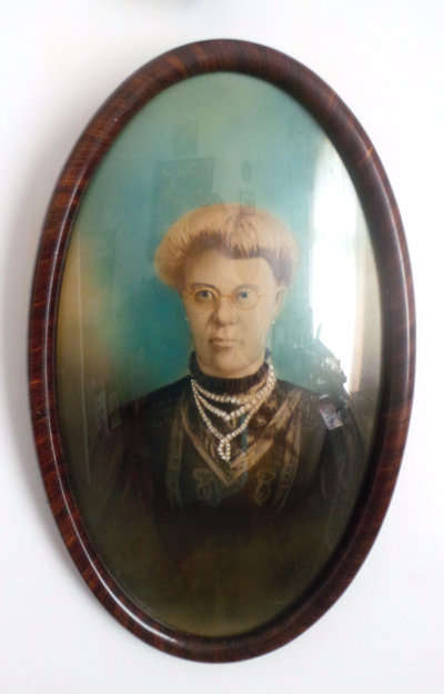 A Vintage Oval Frame with Convex Glass over Portrait of an Old Lady - In Superb Condition***