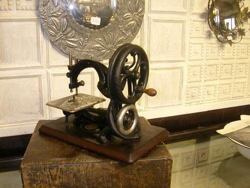 old victorian sewing machine with its original box