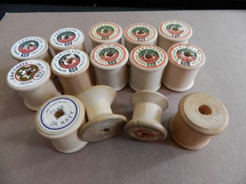 Collection of Vintage empty wooden cotton thread spools.
