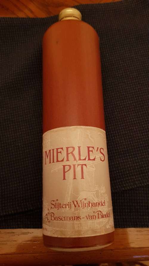 Collectable Stone Bottle (empty) with stopper.  Label  Mierles Pit, tall bottle - colour brown.