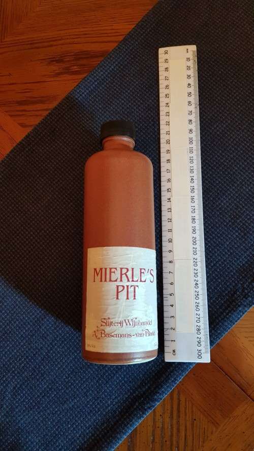 Collectable Stone Bottle (empty) with stopper.  Label  Mierles Pit, Shorter bottle  colour brown.
