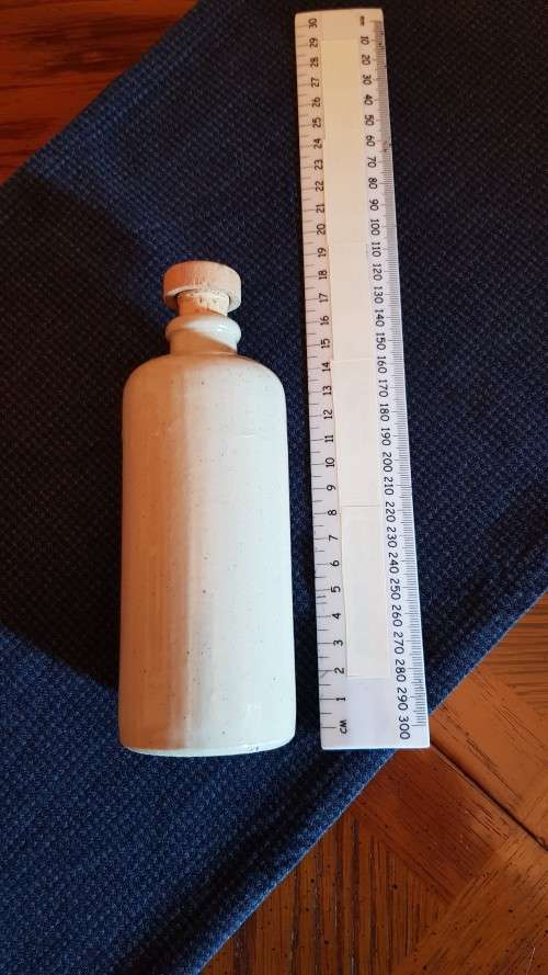 Collectable Stone Bottle (empty) with stopper.  No label. Grey White colour with no label.