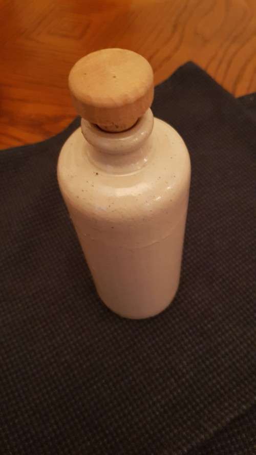 Collectable Stone Bottle (empty) with stopper.  No label. Grey White colour with no label.