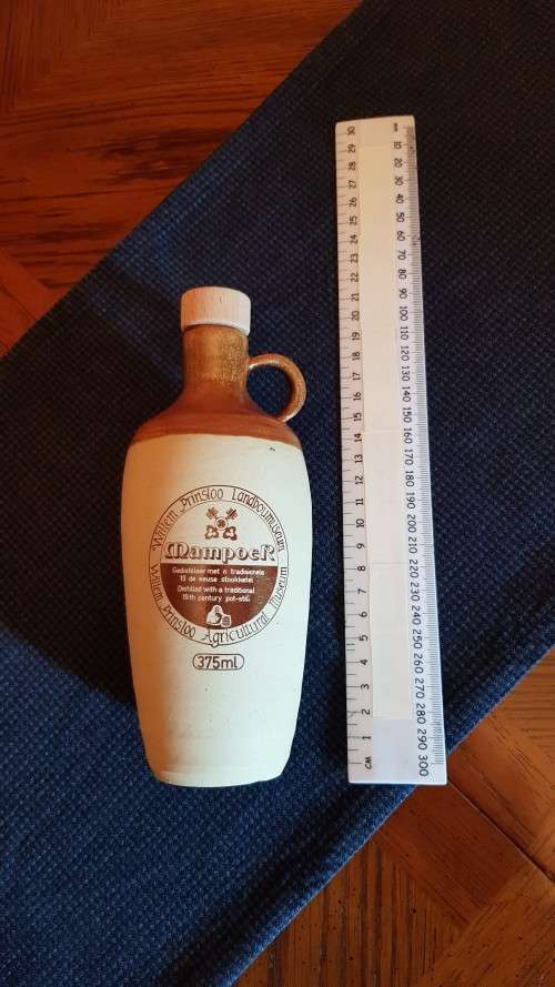 Collectable Stone Bottle (empty) with stopper and round handle.  Mampoer - Willem Prinsloo Agricultu