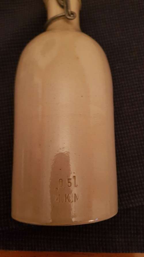 Collectable Stone Bottle (empty) with flip-top stopper and brace.  No label. Colour: Grey/white.