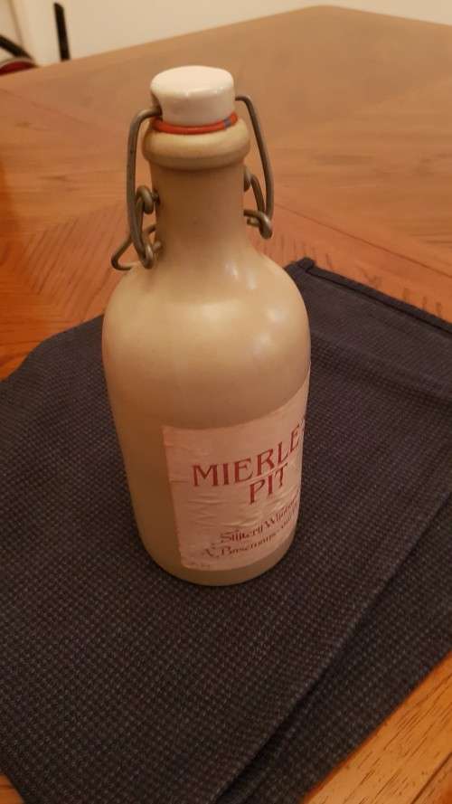 Collectable Stone Bottle (empty) with flip-top stopper and brace.  Label  Mierles Pit.