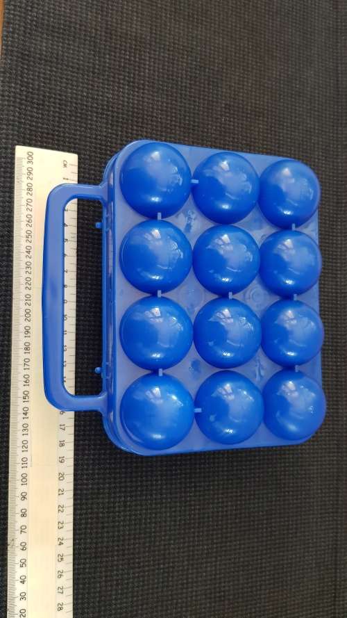 Plastic holder for eggs in blue, with carry handle. Takes 12x eggs.