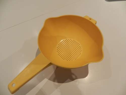 Vintage Round Tupperware Colander with long handle. Colour: Yellow.