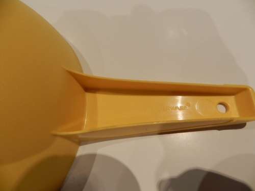 Vintage Round Tupperware Colander with long handle. Colour: Yellow.