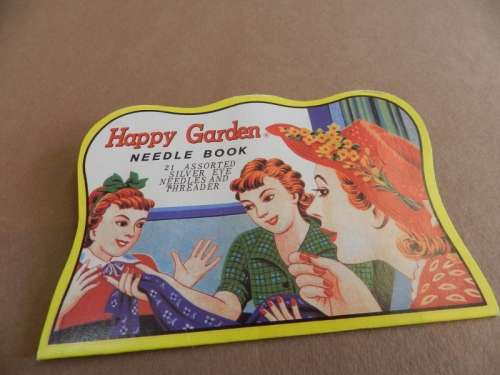 Vintage collectable booklet of 21 assorted silver eye needles and threader.  Happy Garden booklet
