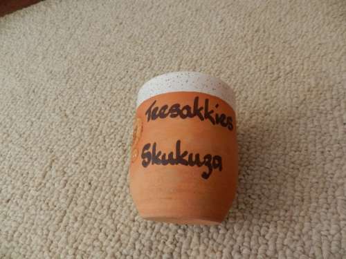 Kruger National Park souvenir: Pottery tea spoon/tea bag holder with ceramic off white interior.