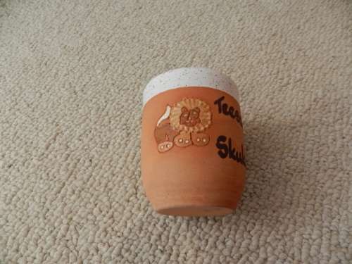 Kruger National Park souvenir: Pottery tea spoon/tea bag holder with ceramic off white interior.