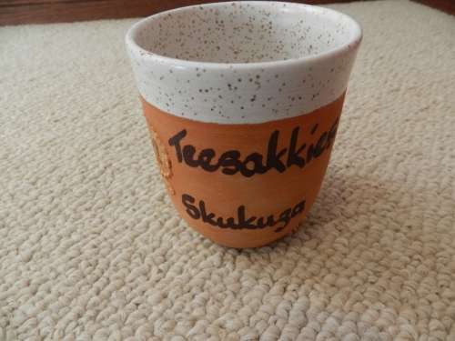 Kruger National Park souvenir: Pottery tea spoon/tea bag holder with ceramic off white interior.