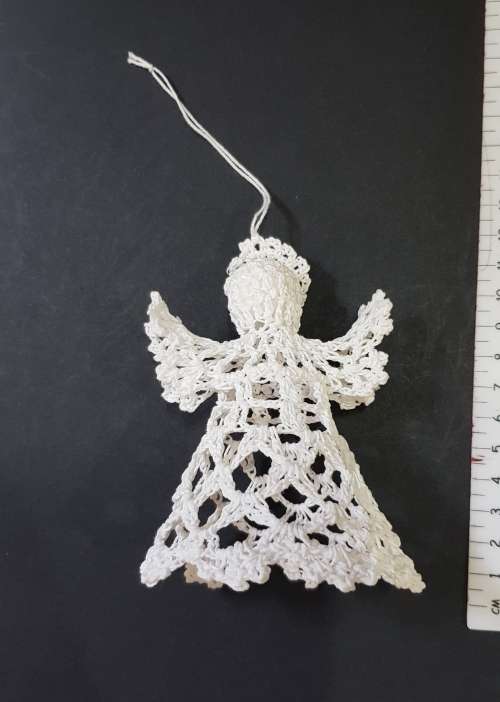Christmas decoration. Small Christmas tree angel in white crochet thread