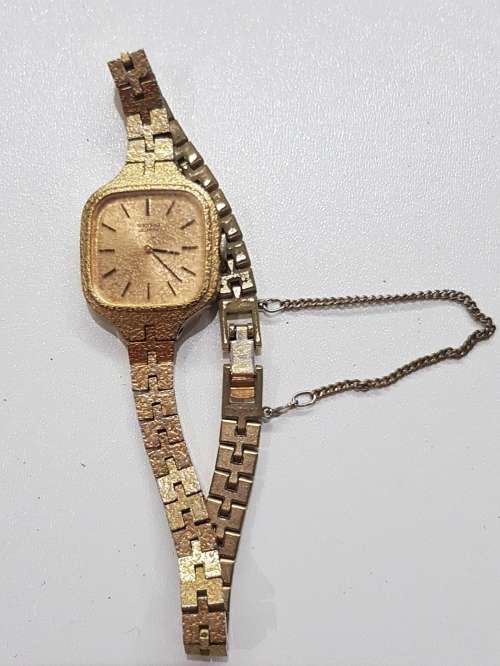 Ladies Seiko Quartz wrist watch. c1980s.  Gold plated with square face and original strap,