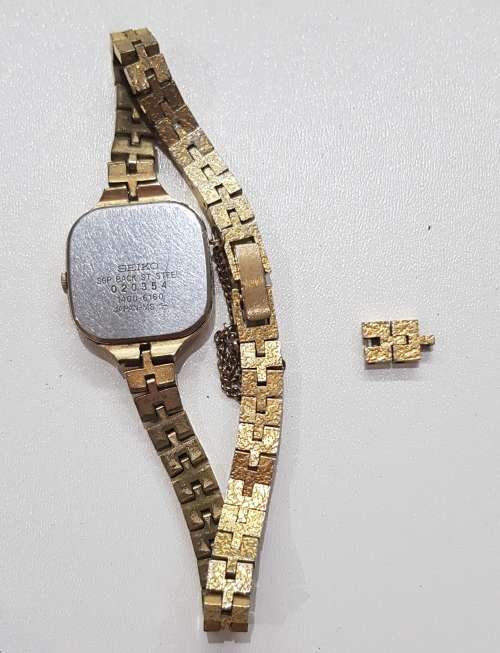 Ladies Seiko Quartz wrist watch. c1980s.  Gold plated with square face and original strap,