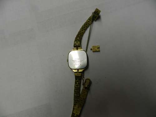 Ladies Seiko Quartz wrist watch. c1980s.  Gold plated with square face and original strap,