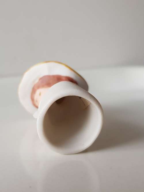 A Vintage collectors thimble. A Bisque Porcelain Thimble - Lady Wearing Hat.