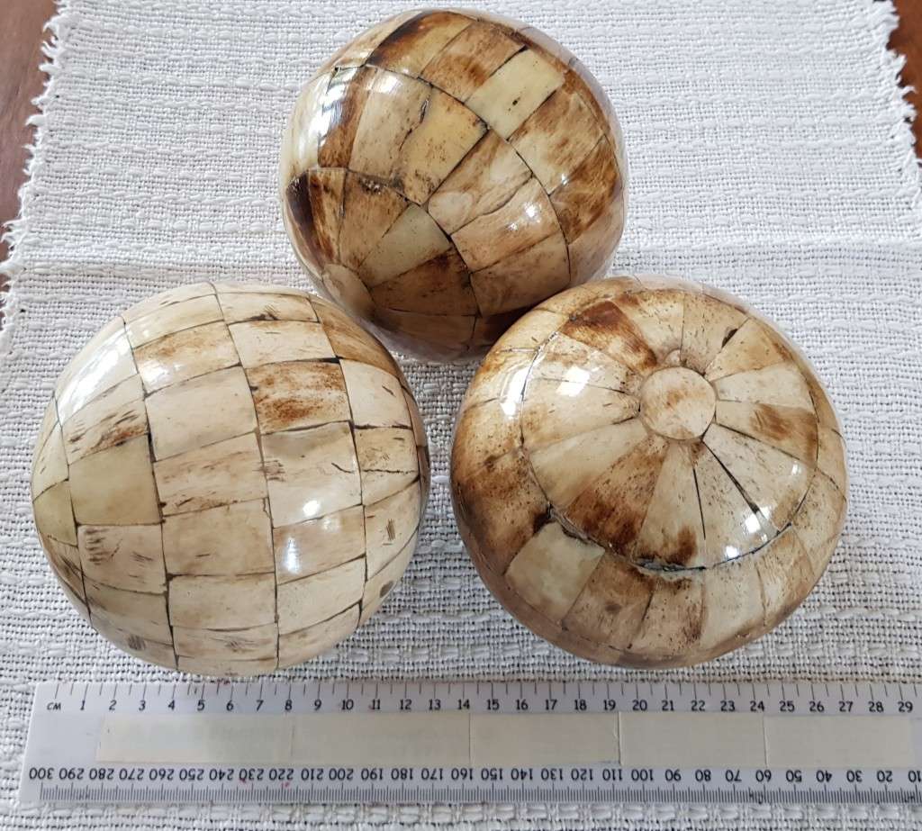 African curios:  Set of three large Decorative balls with inlaid cow horn mosaic around the balls.