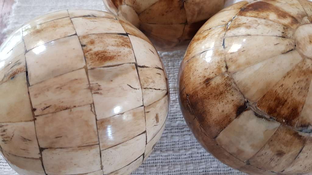 African curios:  Set of three large Decorative balls with inlaid cow horn mosaic around the balls.
