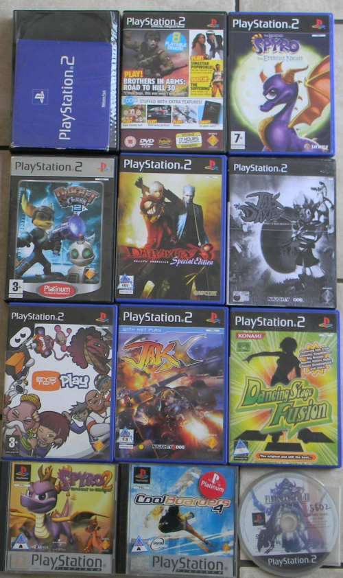 PS2 With lots of extras 3x Controllers Games and Dancing mat