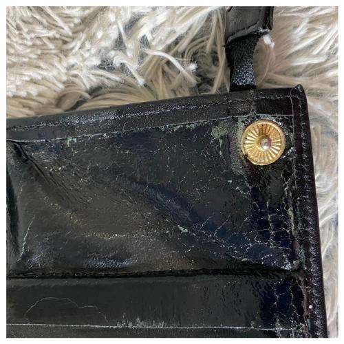 A Vintage Leather Wristlet by Woolworths