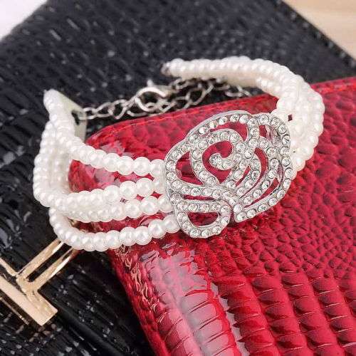 4 ROWS OF FAUX BEAUTIFUL FAUX PEARLS WITH SPARKLING ROSE RHINESTONE BRACELET  SEE MATCHING EARRINGS