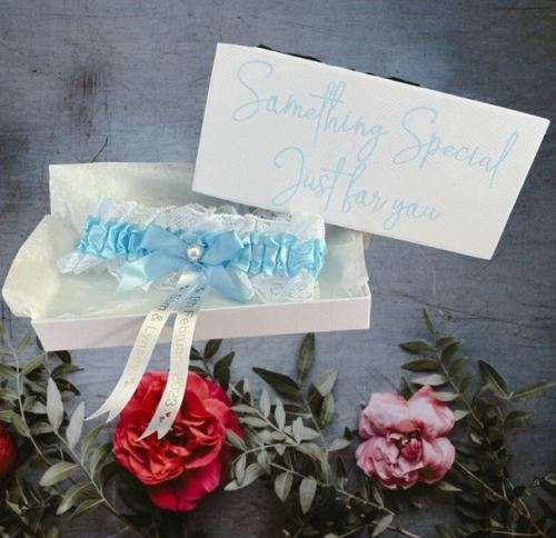 BRIDE`S  SATIN GARTER IN BLUE WITH BLUE SATIN BOW AND WHITE LACE EDGING