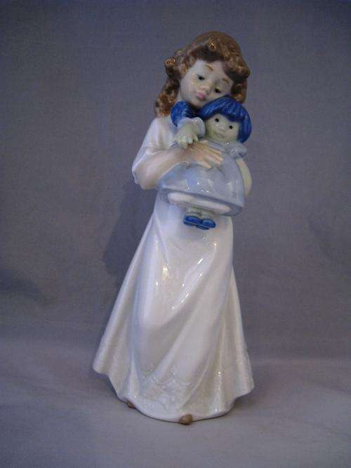 NAO Lladro Porcelain Figurine- Girl holding a Dolly