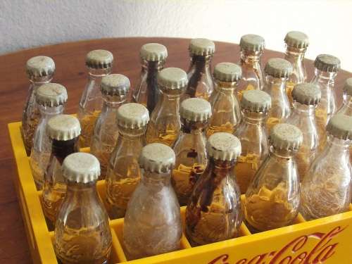 Vintage miniature Coca Cola crate with 24 mini bottles