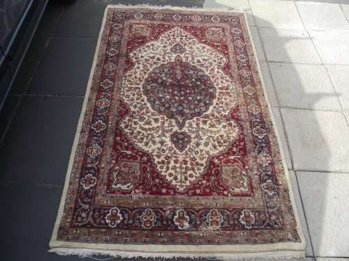 HAND WOVEN PERSIAN CARPET HAS AGE RELATED WEAR