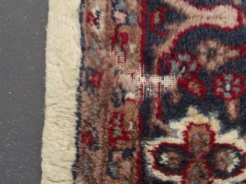 HAND WOVEN PERSIAN CARPET HAS AGE RELATED WEAR