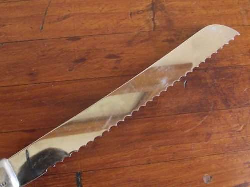 GORGEOUS CARROL BOYES BREAD KNIFE-WAVE