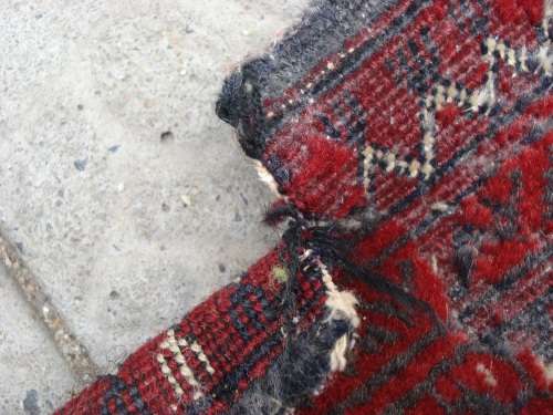 HAND WOVEN PERSIAN RUG --- HAS SOME BALDING AND DAMAGE