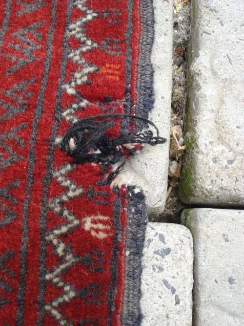 HAND WOVEN PERSIAN RUG --- HAS SOME BALDING AND DAMAGE