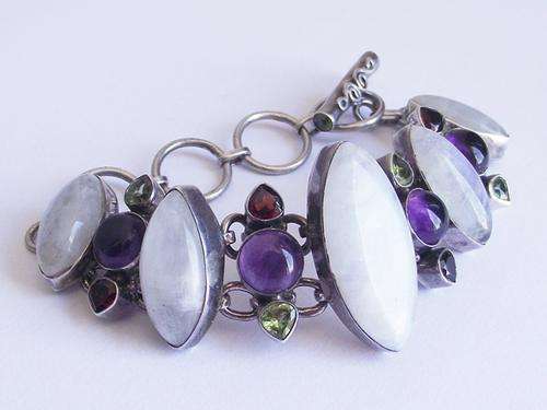 PHENOMENAL STERLING SILVER BRACELET SET WITH MULTI-GEMS: MOONSTONE, AMETHYST, GARNET AND PERIDOT