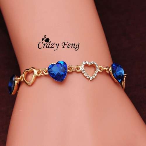 Gold plated tennis bracelet with blue stone
