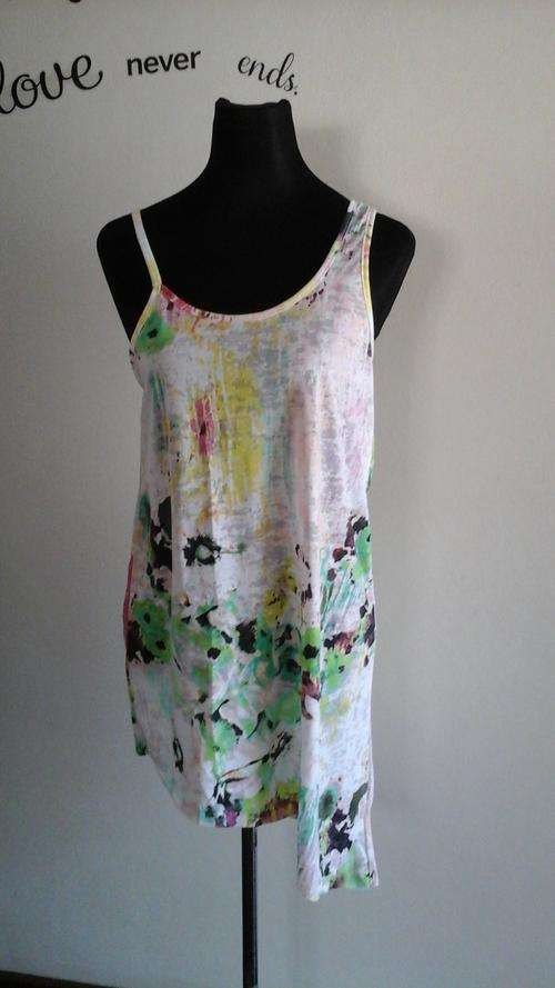 Size 32-34 green floral top with asymmetrical sleeves