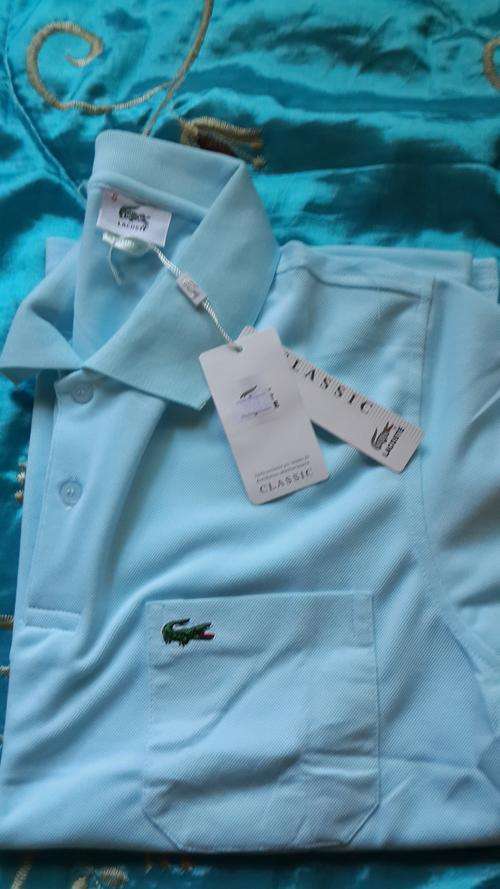 Stunning Light Blue Lacoste Golfer Medium
