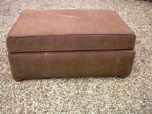 Ottaman in brown upholstery with bun feet